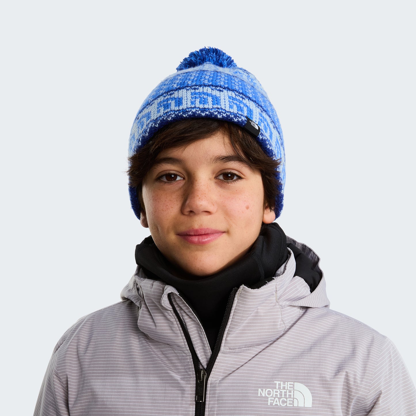 Bonnet à Pompon Enfant Cabin Ski Tuke bleu vif THE NORTH FACE